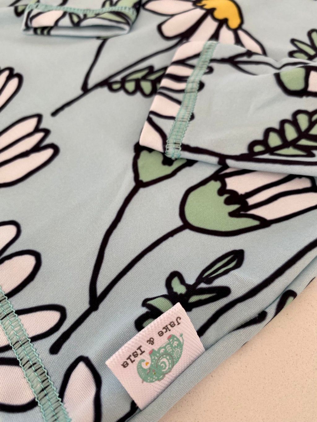 Kiddies Daisy Rash Vest from the Jake and Isla Collection