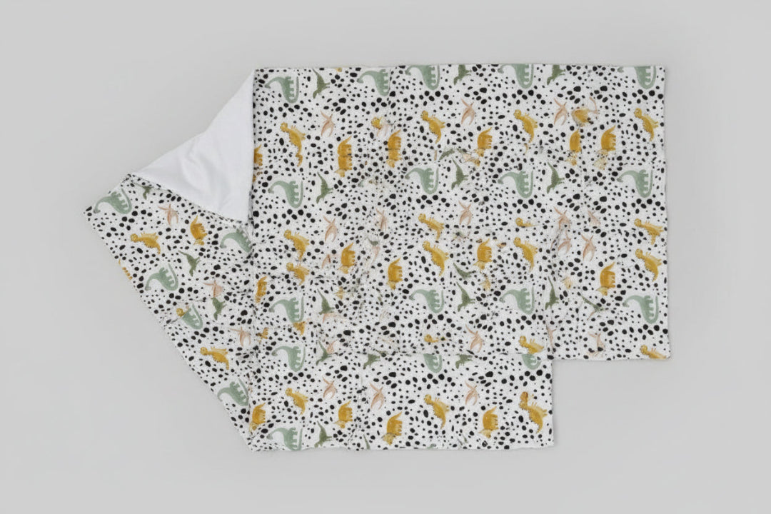 Fabric with dinosaur pattern on a white background
