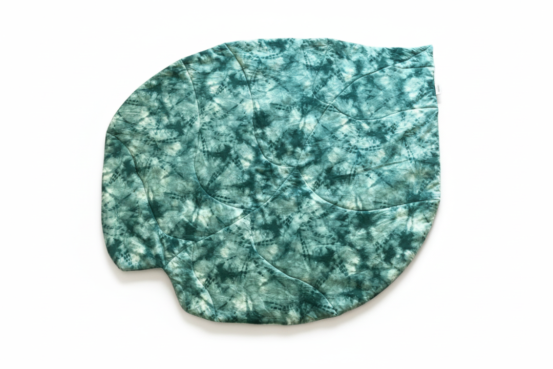 Teal and gray tie-dye patterned product on a white background