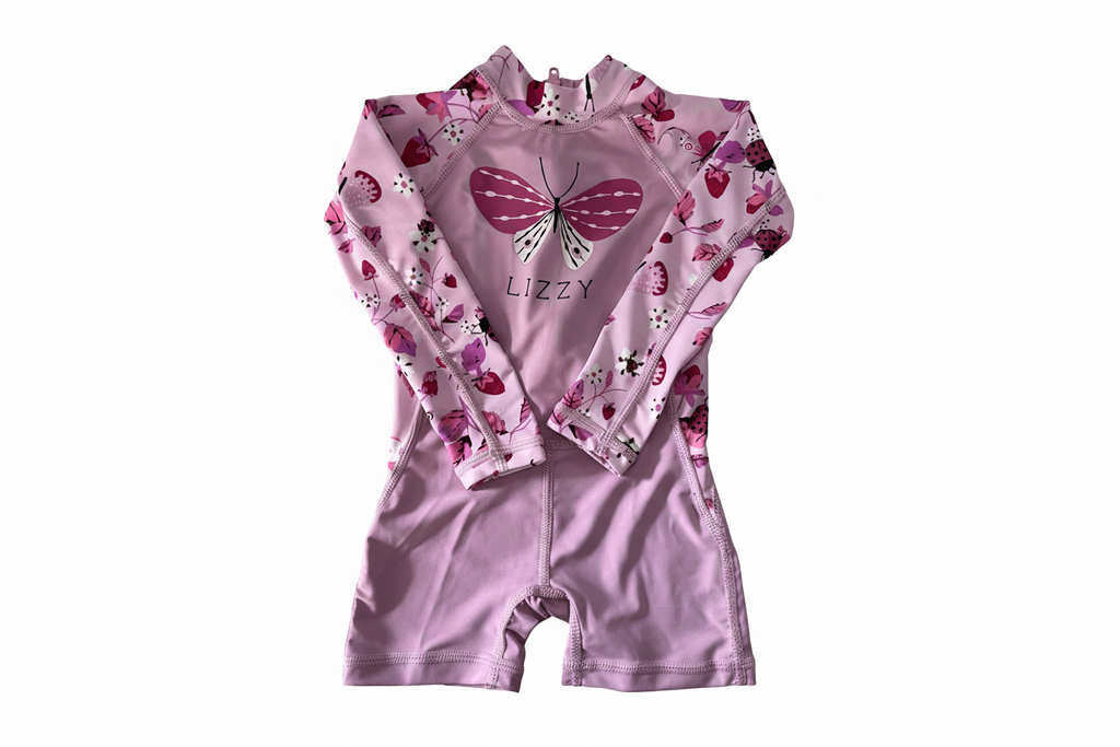 Pink children's swimsuit with butterfly design and 'Lizzy' branding on a white background