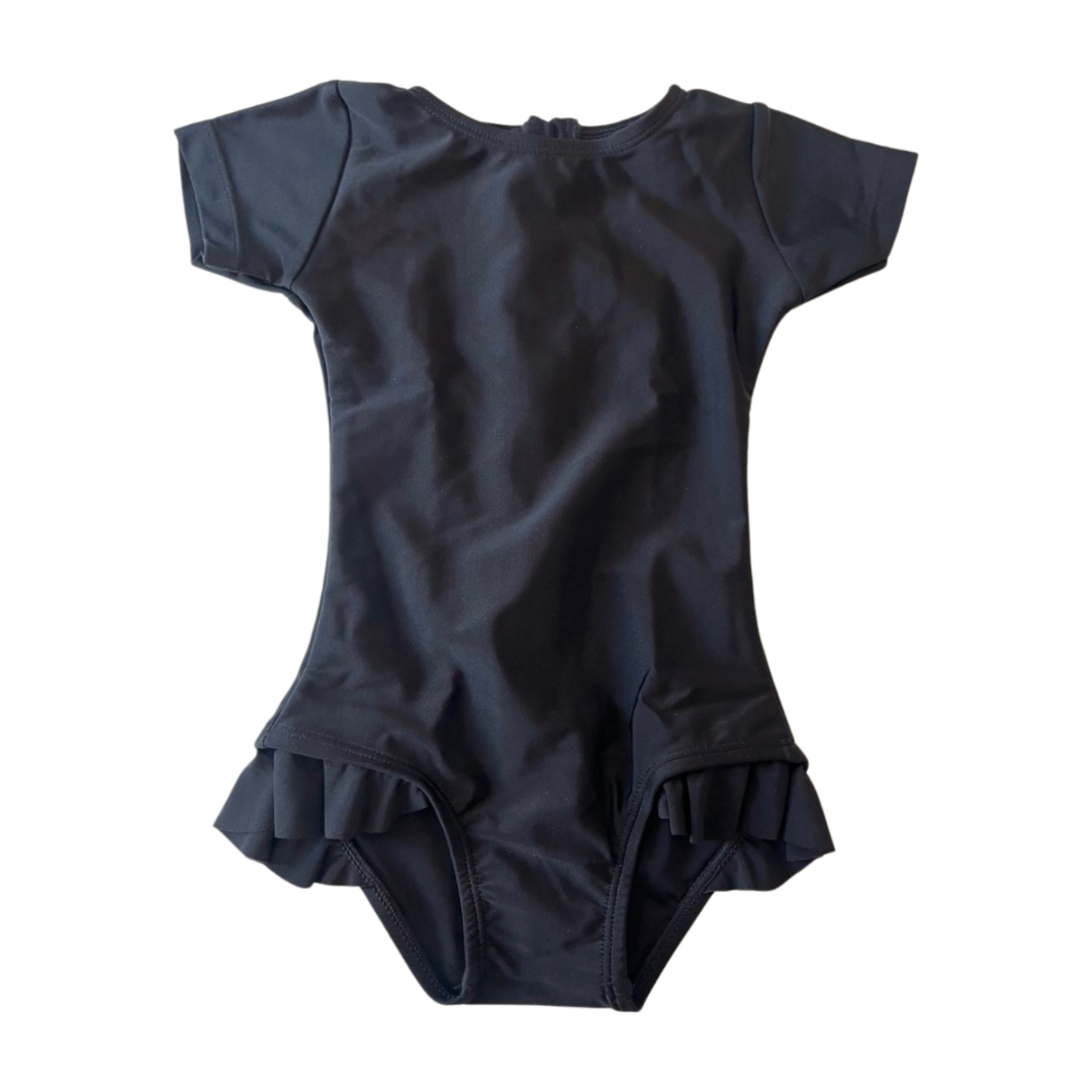 Black baby swimsuit with ruffled details on a white background