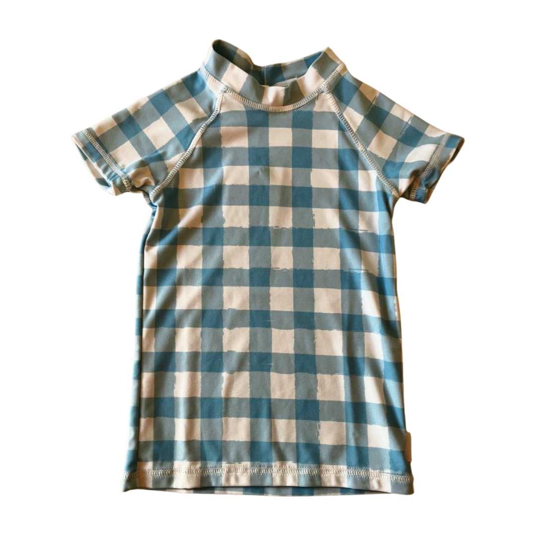 Blue and white checkered shirt on a white background