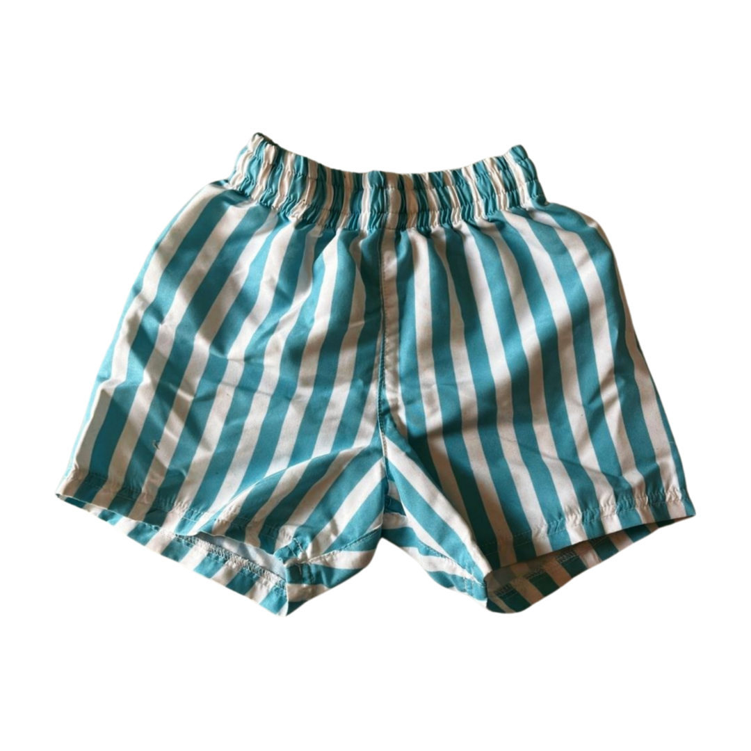 Striped swim shorts with blue and white pattern on a white background