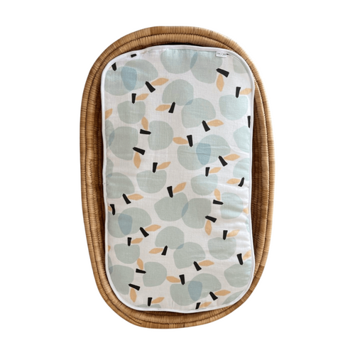 Baby seat cover with leaf pattern on a white background