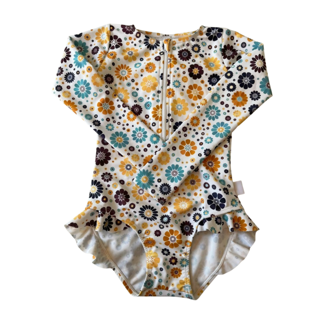 Floral-patterned baby swimsuit on a white background