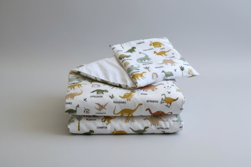 Dinosaurs patterned fabric with names on a white background