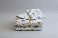 Dinosaurs patterned fabric with names on a white background