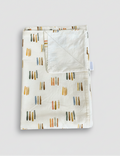 Folded fabric with abstract pattern on a white background