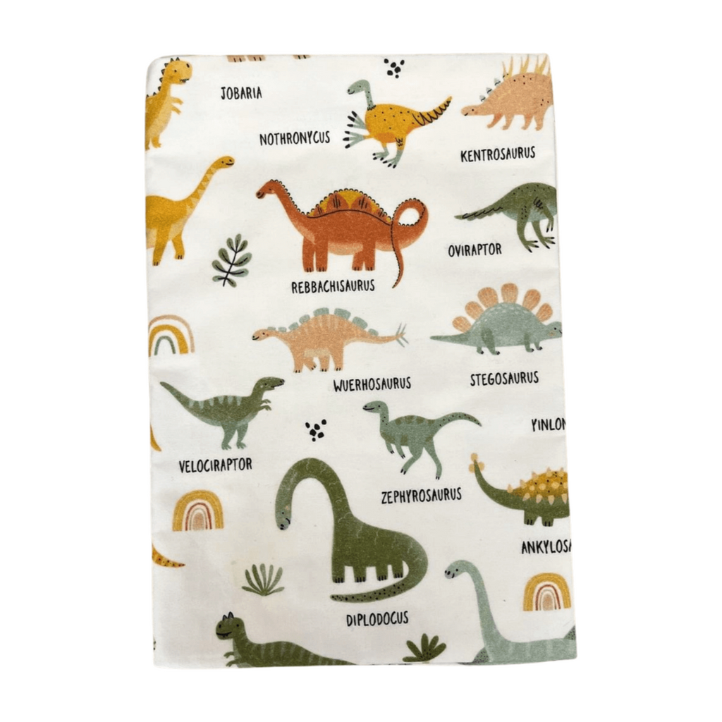 Flannel fabric with dinosaur pattern on a white background