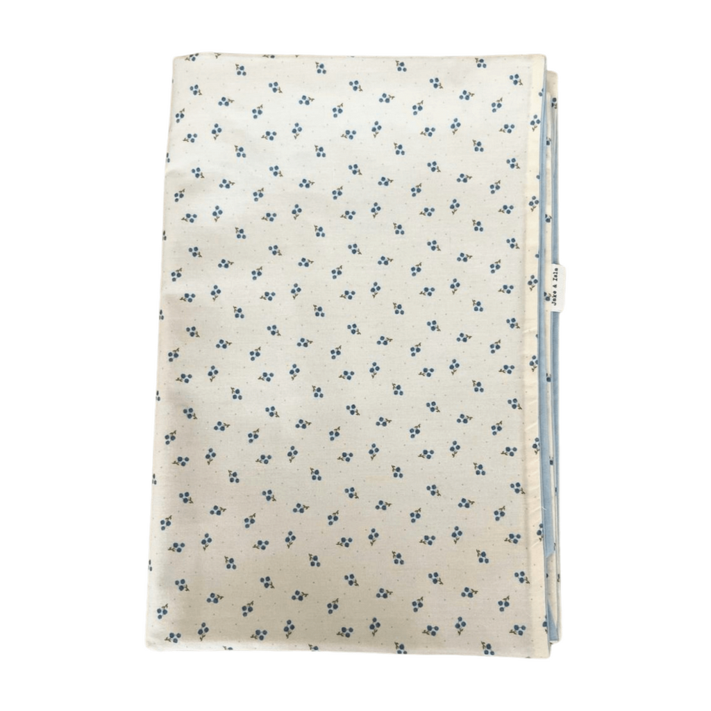 folded duvet with a floral pattern on a white background