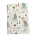Flannel fabric with ocean-themed pattern featuring octopuses, crabs, and ships on a white background.
