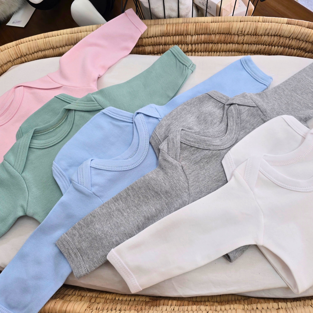 five different colours of envelope neck onesies jake and isla clothing 
