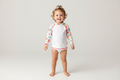 Children's long-sleeve shirt with floral pattern on a white background