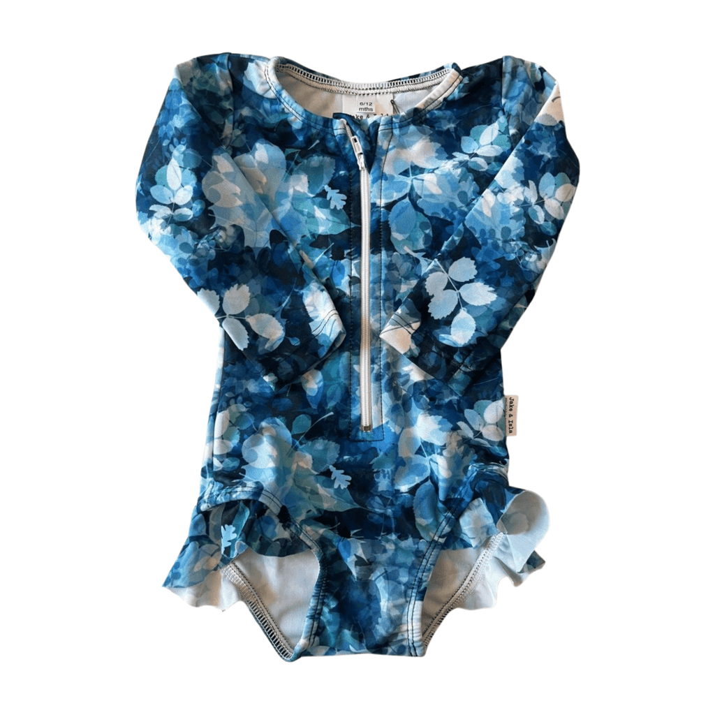 Blue floral patterned baby swimsuit with a zipper on a white background