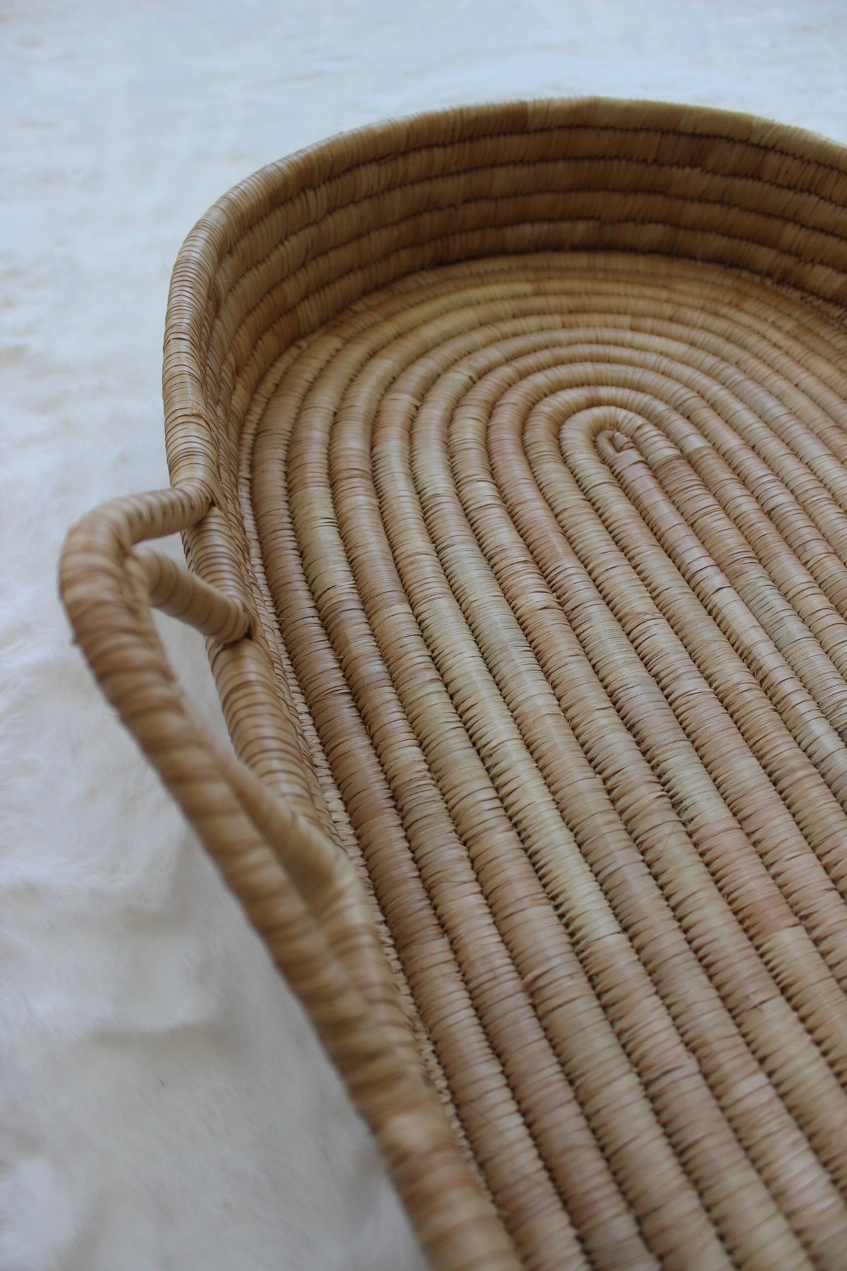 moses changing basket with hanles left side close up