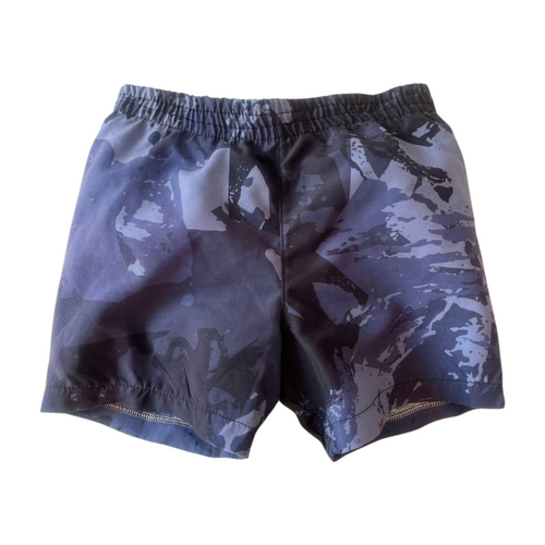 Camouflage-patterned shorts on a white background with built in swim nappy