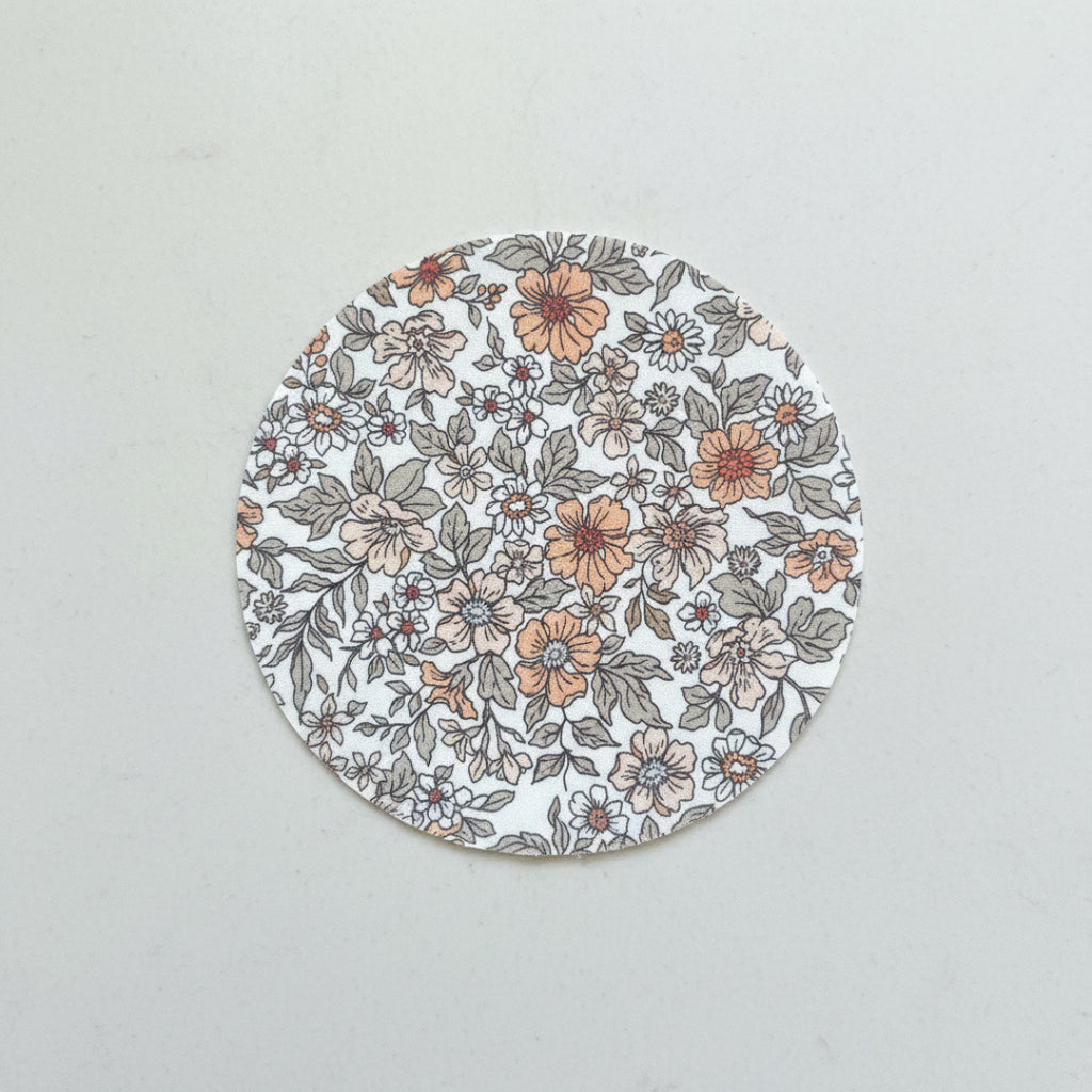Floral pattern with orange, brown, and gray flowers on a white background
