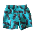Turquoise swim shorts with built in swim nappy with black pineapple pattern on a white background
