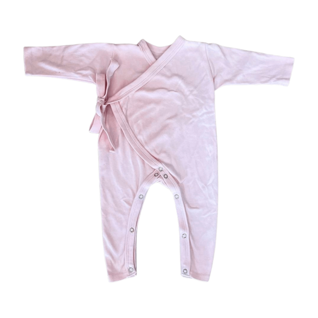 Pink baby wrap with buttons on a white background