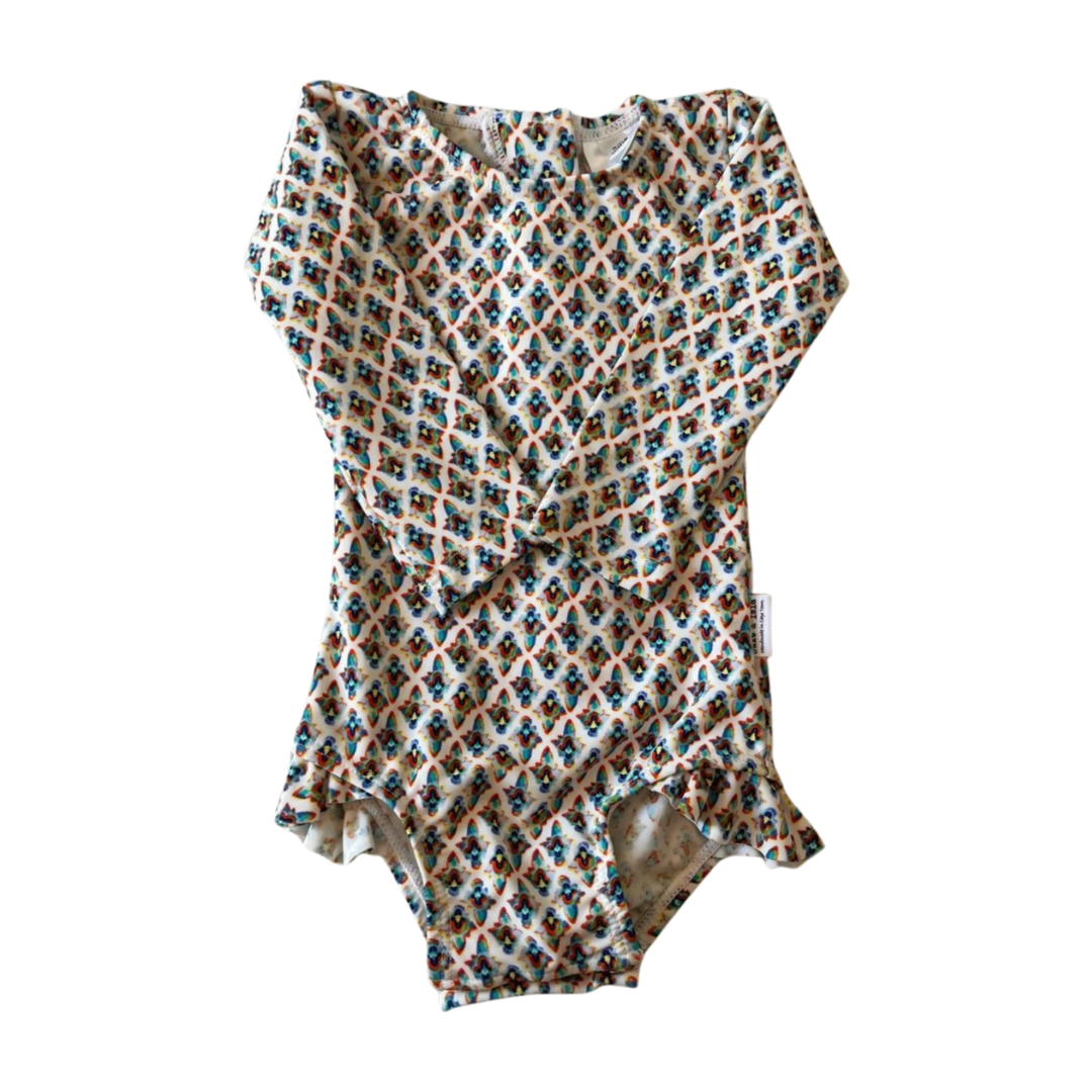 retro baby swimsuit on white background 