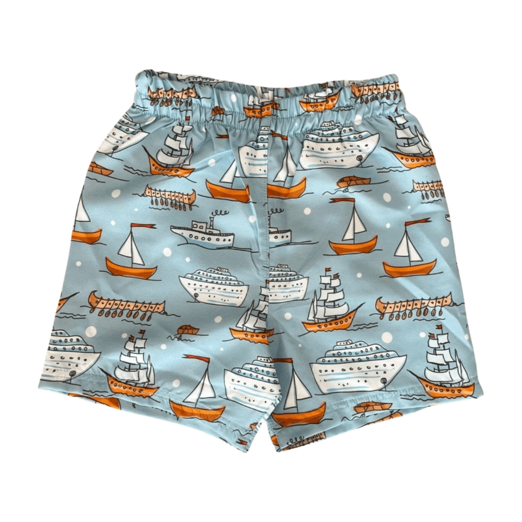 swim Shorts with ship pattern on a light blue background