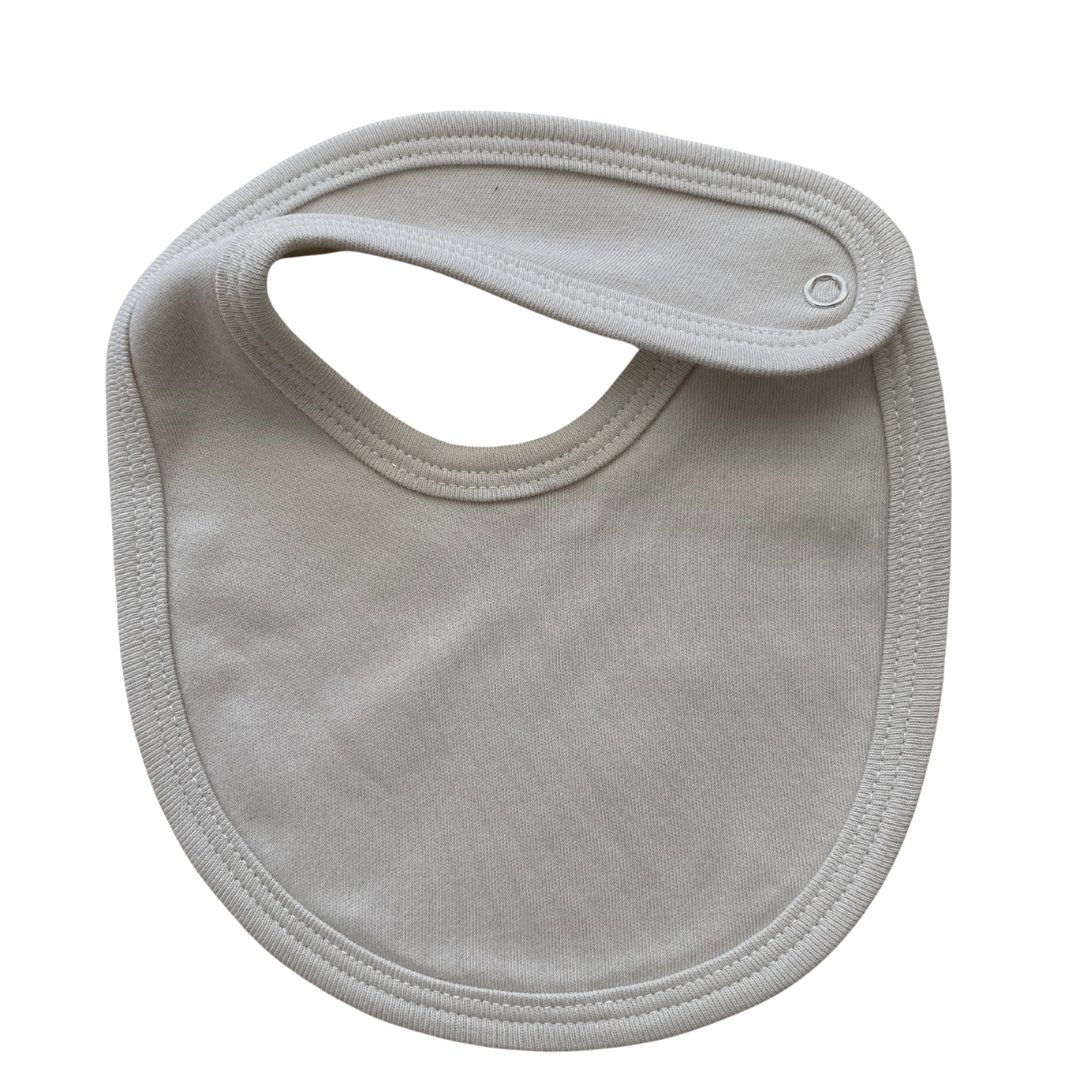stone baby bib on white bacground