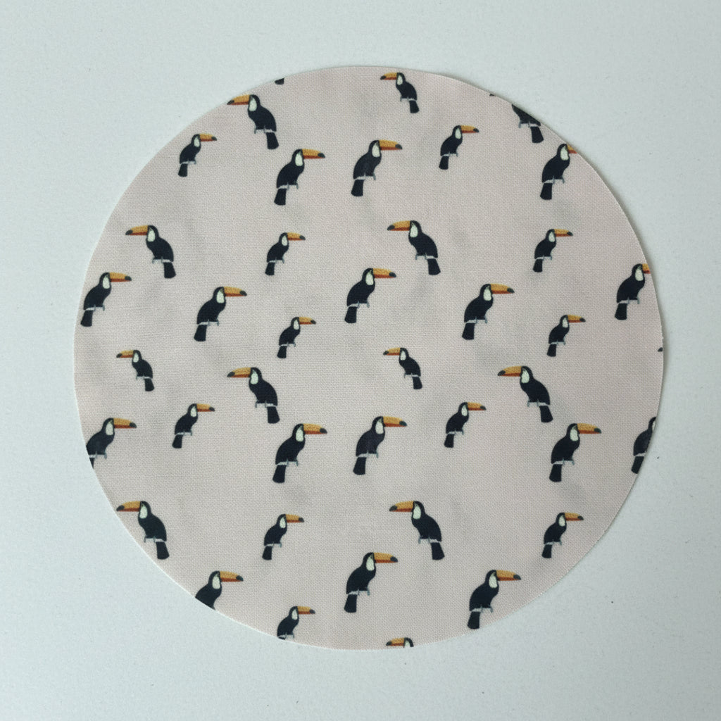 Pattern of toucan birds on a light gray background