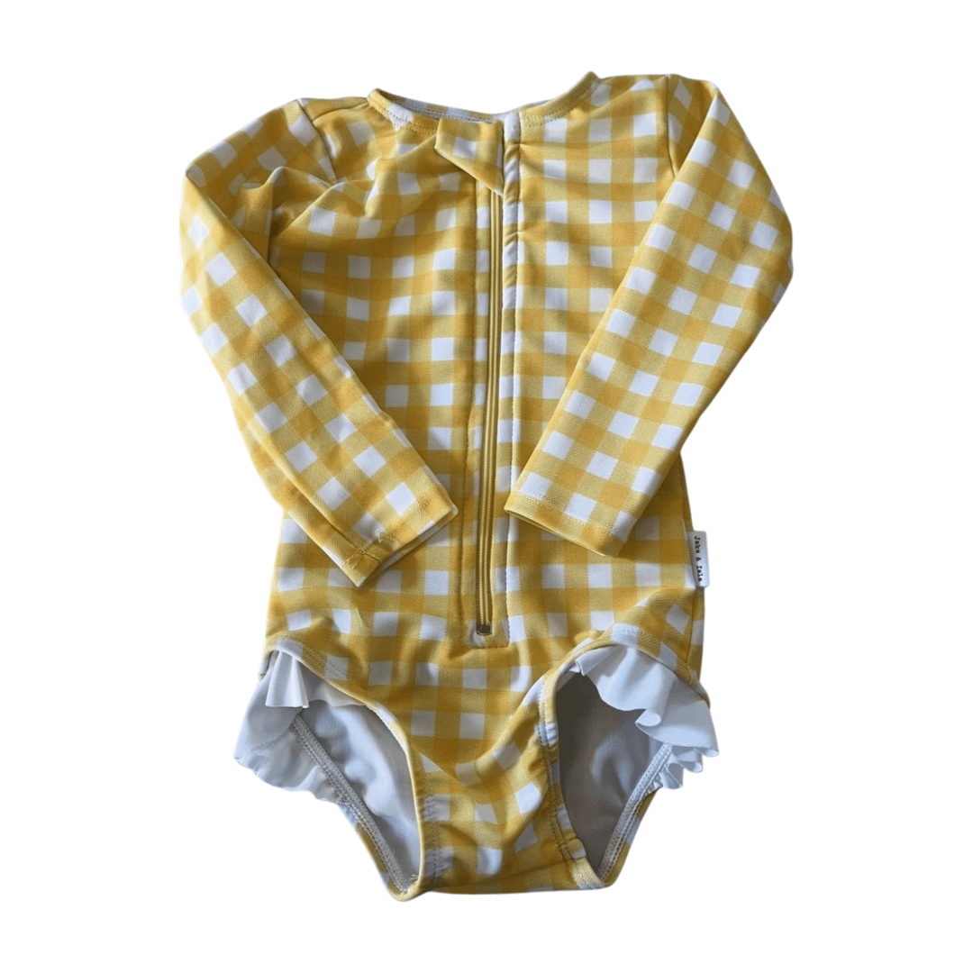 Yellow and white checkered baby swimsuit with long sleeves on a white background