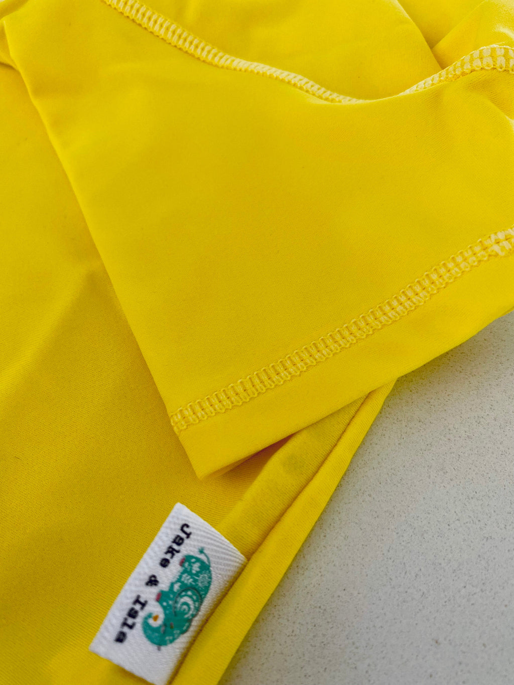 yellow rash vest short sleeved
