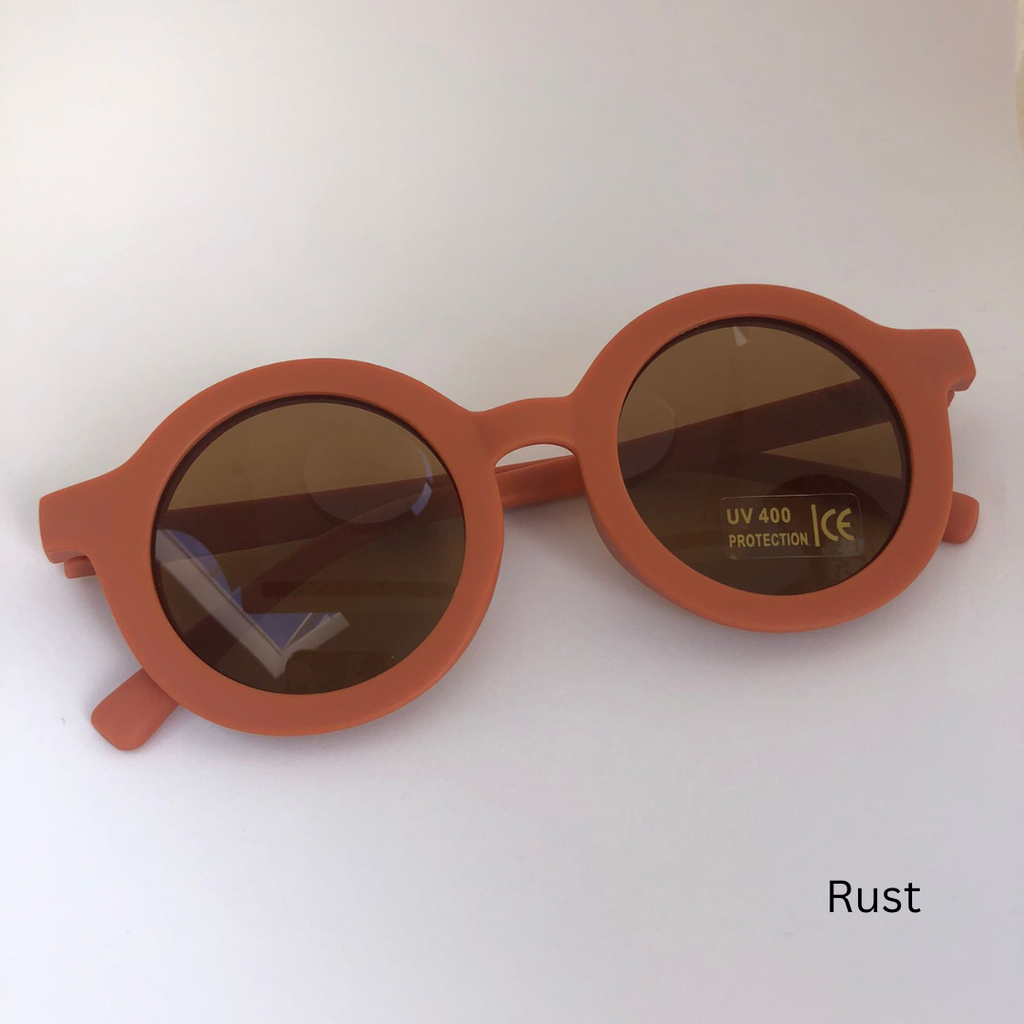 rust sunglasses on white background