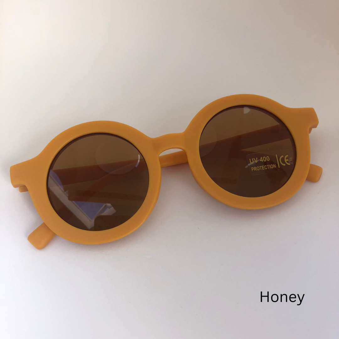 honey sunglasses on white background