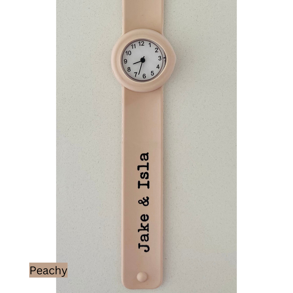 peach watch on grey background